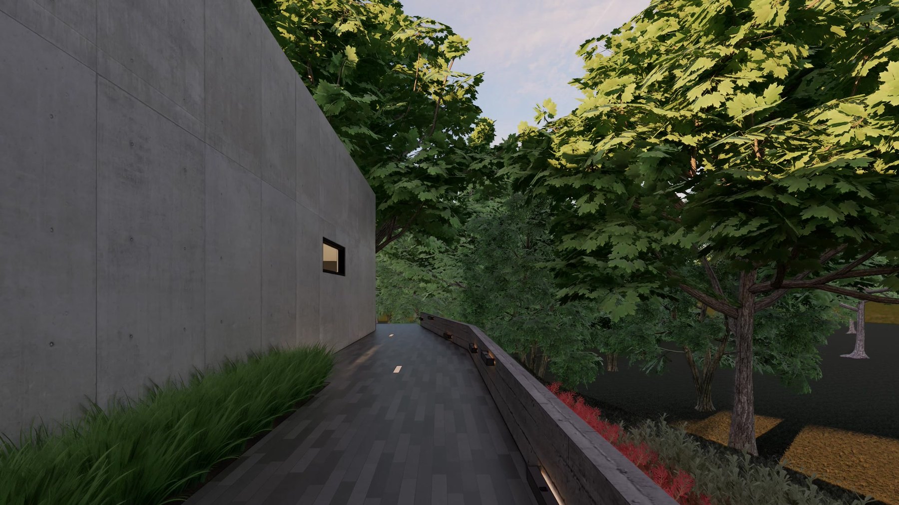 Garden walkway between a tall concrete wall and a screen of mature trees